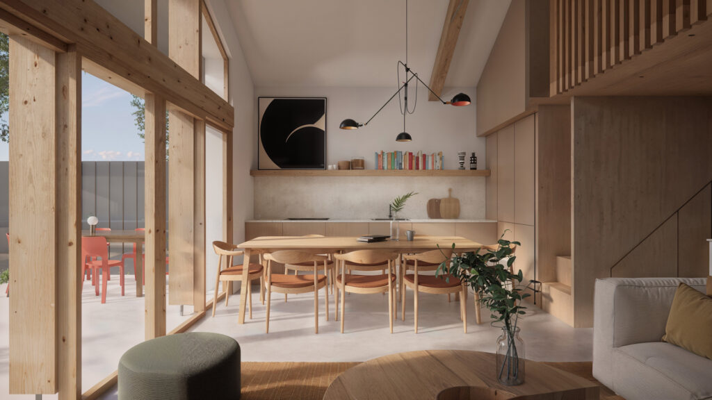 Pièce à vivre ouverte maison basque avec cuisine intégrée et luminaires suspendus